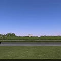 Modern Residential Building Exterior With Balconies Green Lawn And Surrounding Trees Under Blue Sky