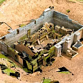 Ancient Ruins Landscape With Square Structure Green Moss On Sandy Ground And Remaining Walls