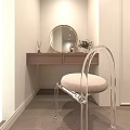 Dressing Table With Golden Round Mirror Two Drawers Aromatherapy Sticks And Transparent Chair