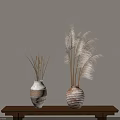 Decorative Ceramic Vases With Dried Pampas Grass On Wooden Table Against Beige Wall