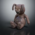 Brown Puppy Plush Toy With Big Ears Round Eyes And Sitting Position On Shiny Surface