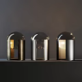 Three Modern Table Lamps With Sleek Metal Base And Transparent Glass Globe Illuminated Warm Light