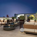 Rooftop Bar Outdoor Seating With Green Plants Water Feature And City Night View