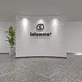 Modern Reception Desk With White Curved Backdrop Iaiammo Sign Green Plant And Marble Floor