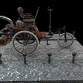 Vintage Tricycle With Wooden Seat Metal Frame And Large Wheels On Stone Pavement