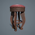 Elegant Wooden Stool with Red Cushion and Intricate Carved Legs