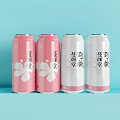 Four Canned Beverages in Pink and White with Floral Patterns and Fruit Labels