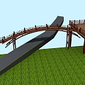 Wooden Bridge Connecting Black Road And Platform Over Green Grass Under Blue Sky