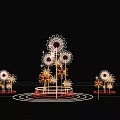 Outdoor Flower Shaped Art Installation with Red White Petals Illuminated at Night Against Building Background