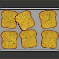 Golden Toast Slices With Yellow Spread And Green Herbs On White Tray