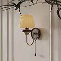 Wall Lamp With Cream Pleated Shade Dark Wooden Base Golden Arm On White Striped Wall