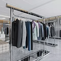 Modern Clothing Store Open Layout With Metal Racks Hanging Clothes And Floor to Ceiling Windows
