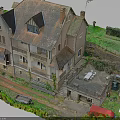Traditional Stone Building With Sloped Roof Balcony Courtyard Table Chairs Green Vegetation