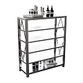 Open Metal Frame Storage Cabinet With Glass Shelves And Decorative Items