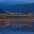 Wooden Boat With Illuminated Lights And Reflection On Water Against Mountain Night View