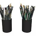 Various Paintbrushes Stored in Two Black Pen Holders on White Background