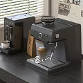 Modern Dark Gray Coffee Machines As Kitchen Appliances On Tabletop With Coffee Cup And Bag