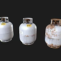 Three Industrial Propane Tanks Showing Various Degrees of Wear and Rust
