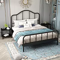 Black Metal Frame Double Bed With Curved Headboard White Pillows Blue Cushion And Nightstands