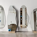 Four Irregular Shaped Mirrors Decor Modern Interior Against White Wall With Wooden Floor And Plants