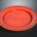 Red Carved Sculpture Plate With Intricate Decorative Edges And Embossed Center Design