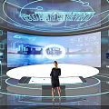 Person Engaging With Smart City Tech Display On Large Screen Featuring Urban Landscape And Digital Data