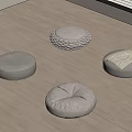 Soft Round Floor Cushions with Various Designs on Light Wooden Floor