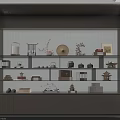 Modern Decorative Cabinet With Green Vertical Striped Backdrop And Shelves Displaying Vases Plates Books