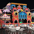 Colorful Mall Shop With Children's Play Structure Welcome Sign And White Tables Chairs