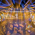 Modern Stage Setup With Illuminated Lighting Steps Backdrop Displays And Front Table