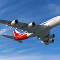 Red and White Passenger Plane Flying Over Mountainous Landscape With Blue Sky and Green Vegetation