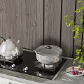 Gas Stove Top In Modern Kitchen With Silver Kettle Covered Pot Red Berries And Green Plant