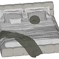 Comfortable Double Bed With Upholstered Headboard Plaid Pillows Round Cushion And Green Blanket