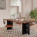 Wooden Dining Table With Black Legs And Rattan Back Chairs Indoor Green Plant
