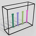 Transparent Display Case With Black Frame Holding Four Colorful Strip Objects