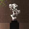 Artistic Hollow Stone Sculpture With Black Base And Latticed Wall Background
