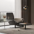 Black Leather Lounge Chair With Ottoman Side Table And Floor Lamp By Window