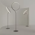 Sleek Modern Floor Lamp Featuring Circular Light Ring And Black Metal Stand In Minimalist Interior