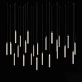 White Cylindrical Chandeliers Hanging In Black Background With Slim Elongated Design And Bottom Light Sources