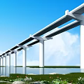 Elevated Bridge with White Piers Spanning Water Under Blue Sky White Clouds and Green Vegetation