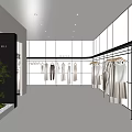 Modern Minimalist Clothing Store Interior With Clothes On Hangers And Plant Decoration