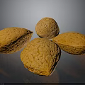 Five Fresh Orange Speckled Almonds Placed on Black Reflective Surface