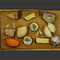 Assorted Cheese Platter With Various Shapes Colors On Wooden Board Including Ham Slices