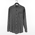 Men's Clothing Including Gray Pants Plaid And Striped Shirts On Wooden Hangers