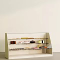 Assorted Delicious Desserts and Cakes in White Display Case with Shelves
