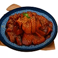 Braised Red Meat With Sesame Seeds Green Garnish On Blue Patterned Plate Wooden Trivet