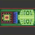 Colorful Household Tray With Divided Sections In Various Colors And Small White Object On Top