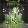 Stunning Art Installation With Green Transparent Columns Fresh Flowers Hanging Butterflies And Hanging Greenery