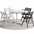 Round White Dining Table With Two White And Two Black Chairs On Light Round Rug 3d model