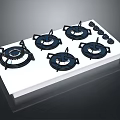 Four Burner Gas Stove With White Surface Black Burner Covers And Control Knobs